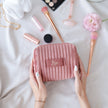 Personalized makeup bag held in hands velvet cosmetic pouch lifestyle