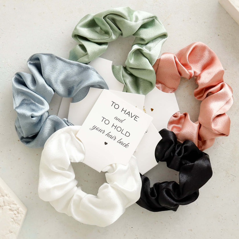 Open bridesmaid gift box with items inside elegant set