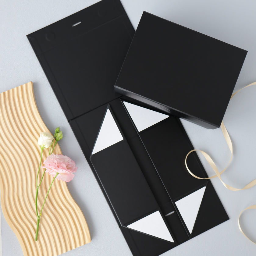 Black magnetic gift box with ribbon top view packaging