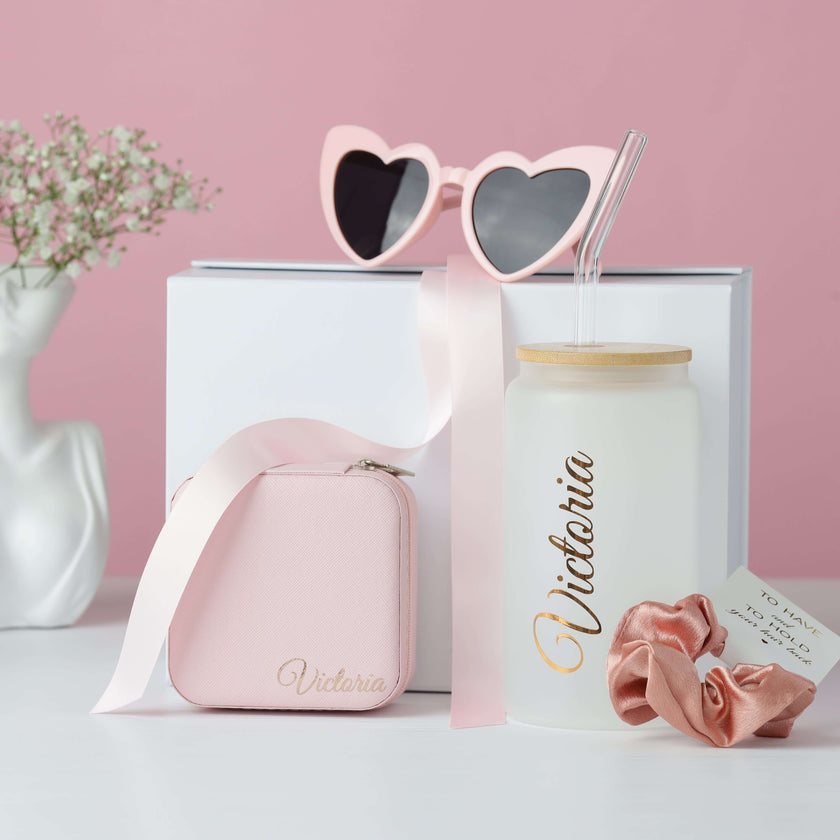 Pink bridesmaid gift box with tumbler and cosmetic accessories