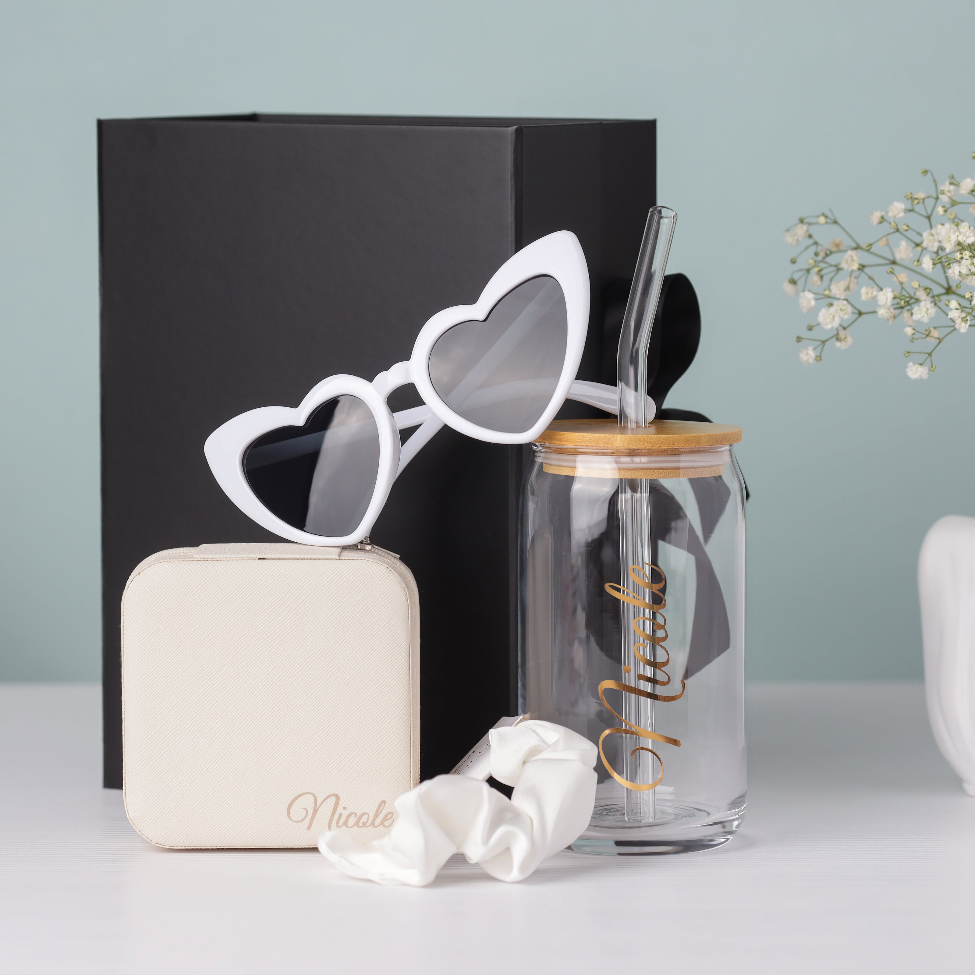 Bridesmaid gift box open with tumbler and items inside