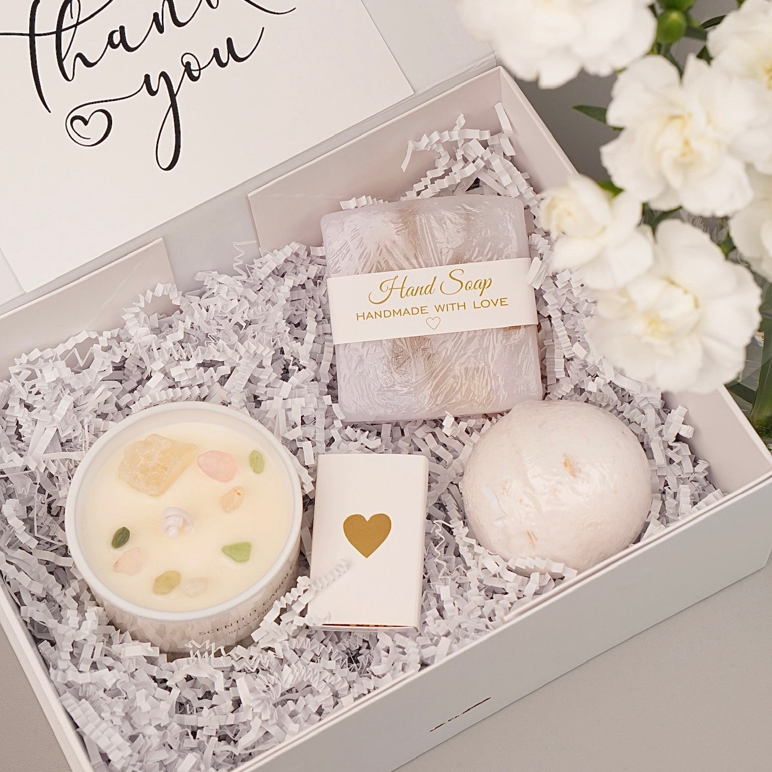 Cozy hygge gift box with candle skincare and bath essentials