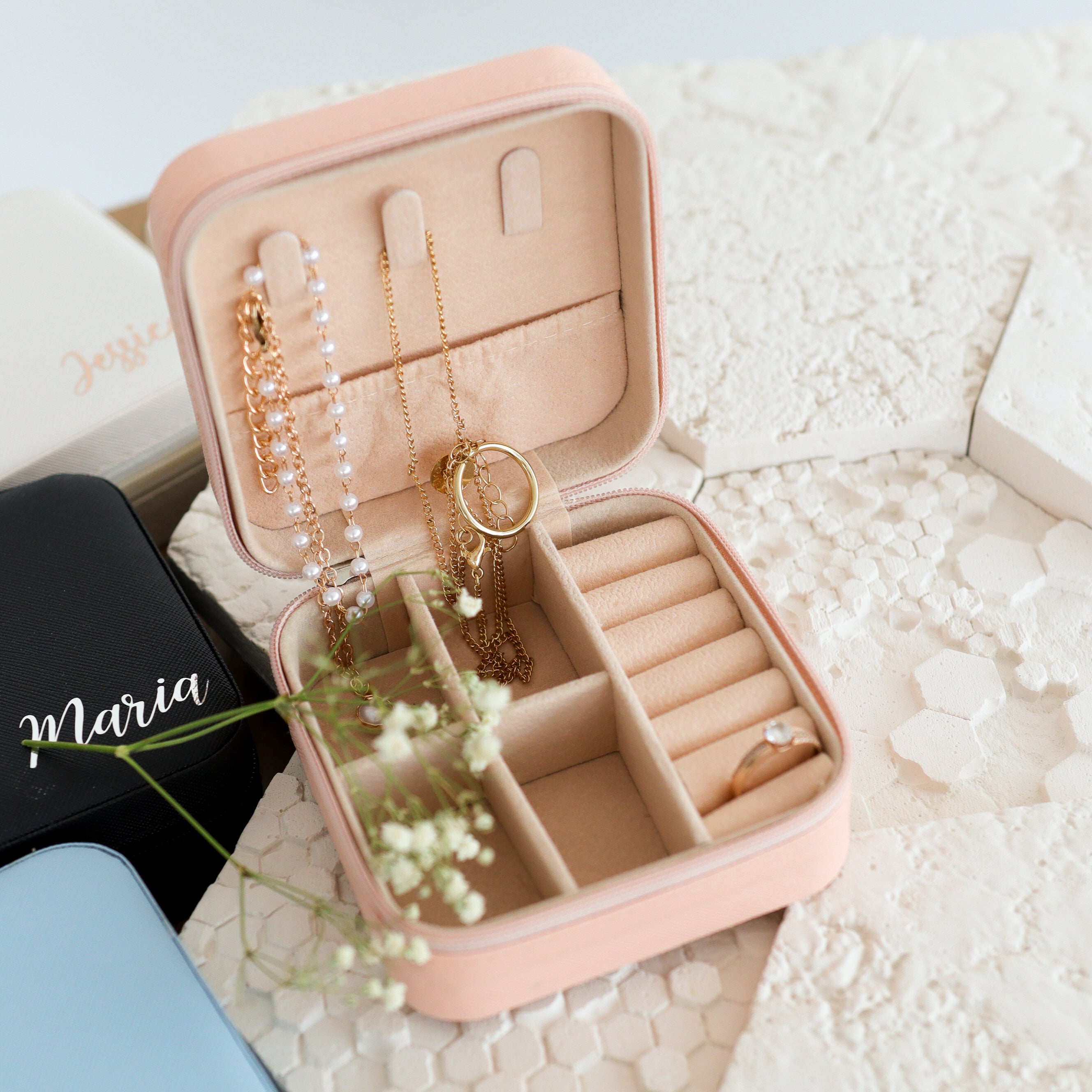 Open jewelry box with rings and compartments travel organizer