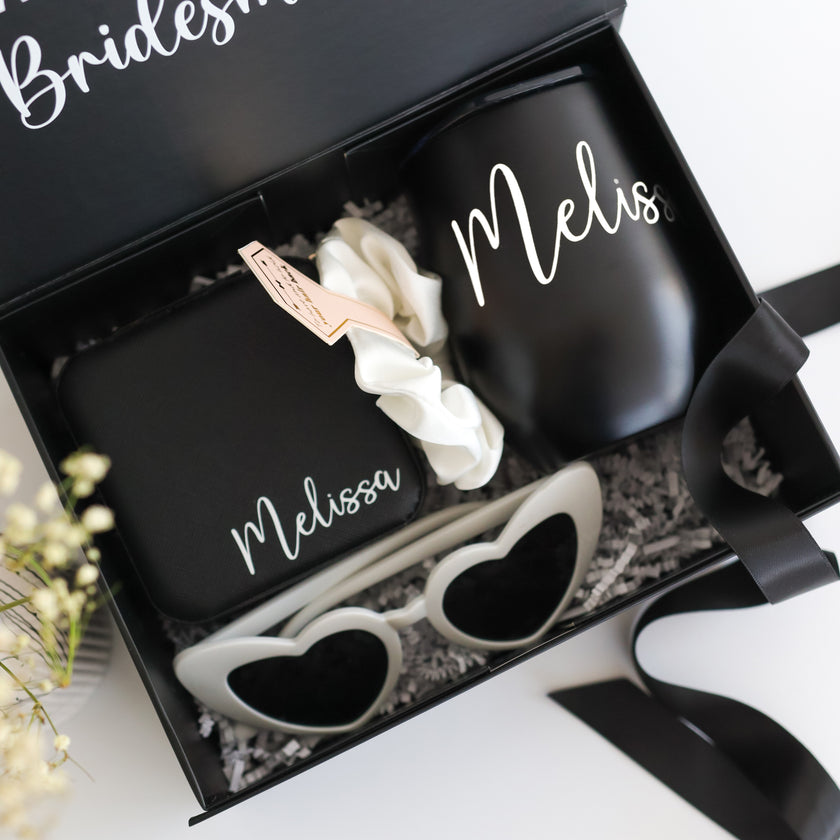 Black bridesmaid gift box open with tumbler inside